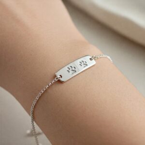 Personalized cat bracelet with an engraved paw print, a meaningful piece of cat jewelry.