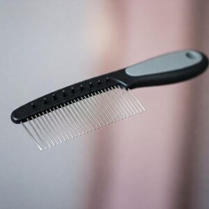 A specialized cat comb designed for grooming long-haired cats and preventing mats.