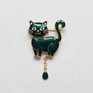 Playful enamel cat brooch with a dangling tail, a fun addition to any cat jewelry collection.