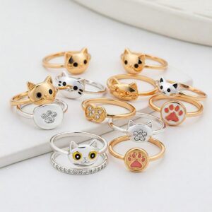 Set of stackable rings featuring various cat-themed elements like tails and faces.