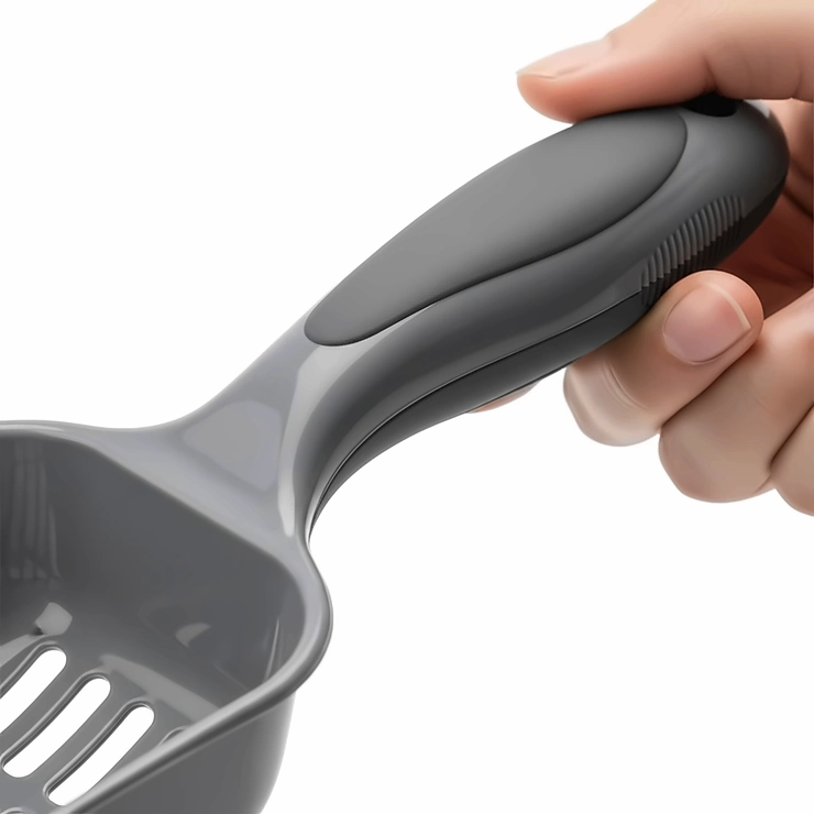 A close-up showing the ergonomic handle of a cat litter scoop, designed for comfortable use and to reduce wrist strain.