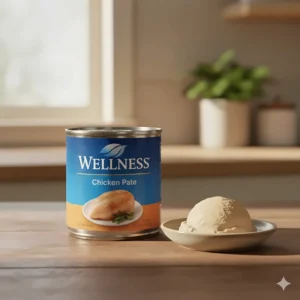 A can of Wellness brand chicken pate cat food, featuring the "chicken pate" label clearly visible on the packaging.